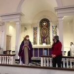 Mother Lisa Mitchell lauds Chris Psolka 
for her 20 years' service at Christ Church.